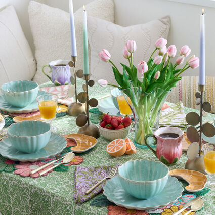 Spring tablescape in saturated pastel florals, featuring beaded floral placemats