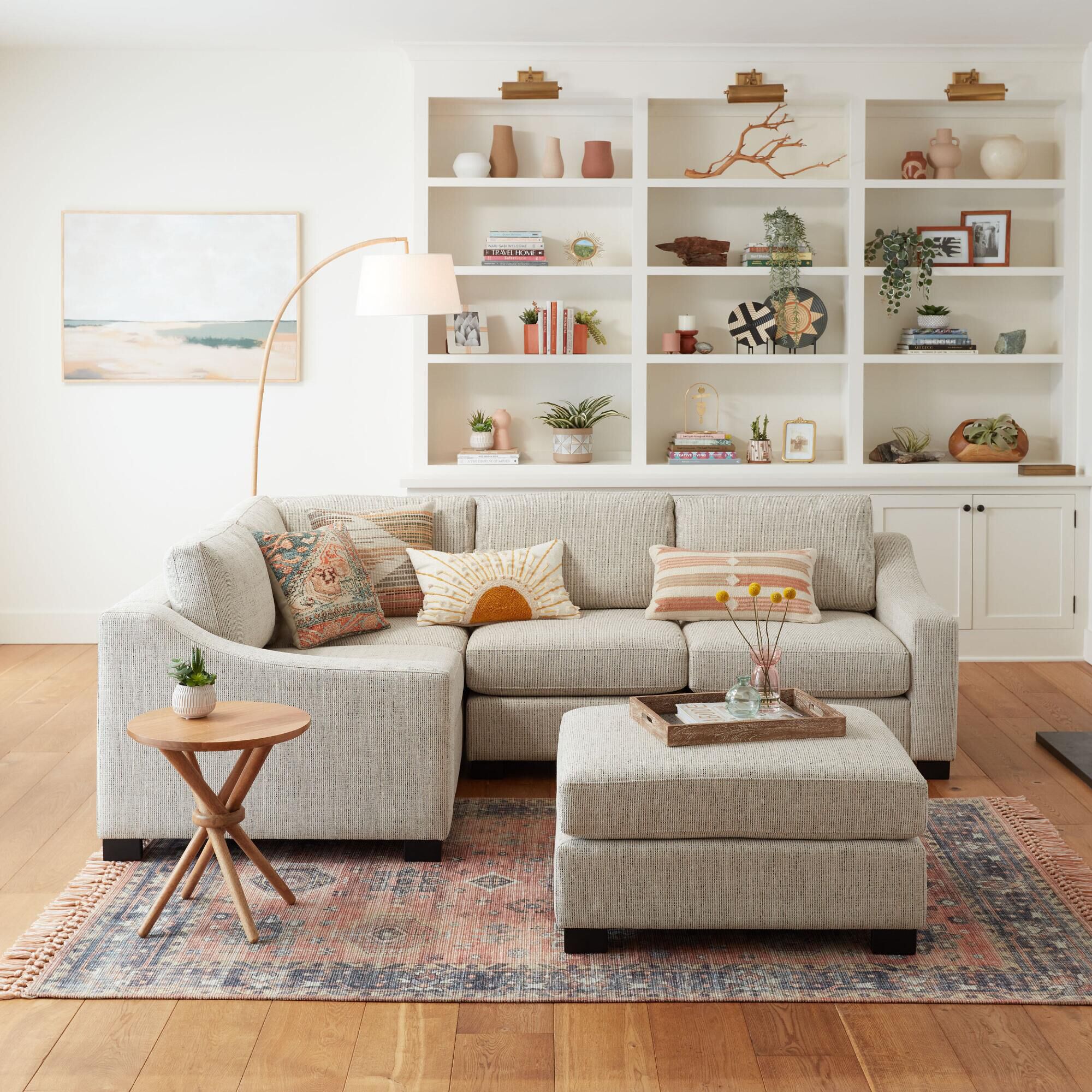 Cream sectional shop with ottoman